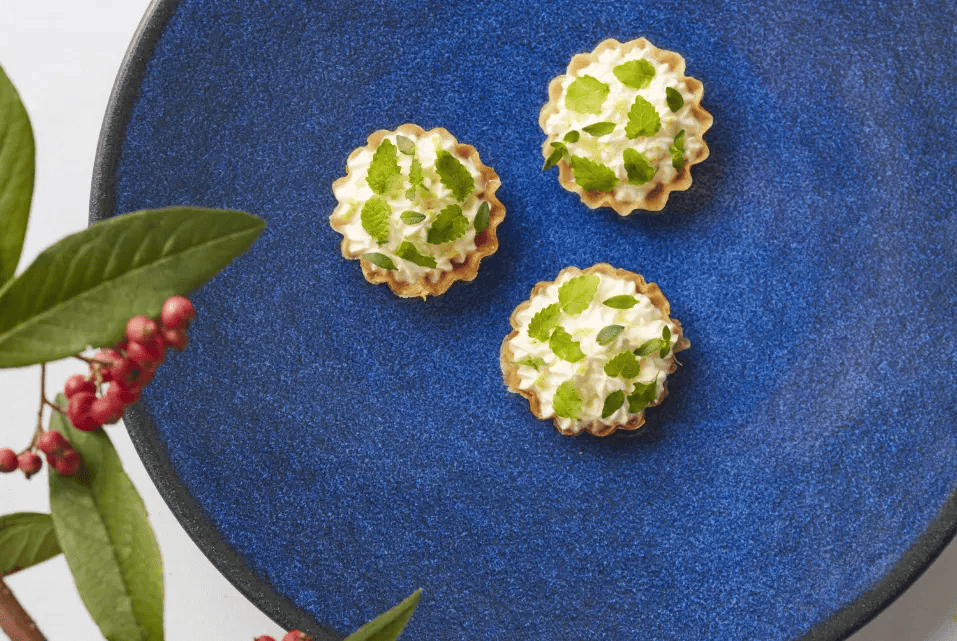 Trio of vegetarian dish on a blue plate.